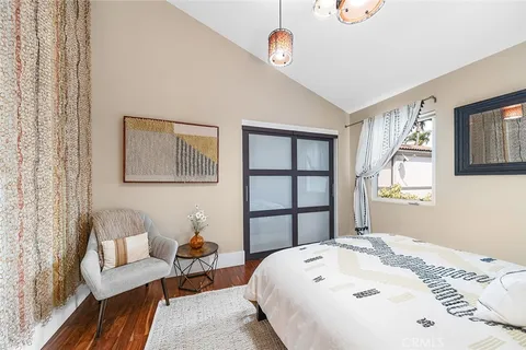 a view of a hallway view with wooden floor and furniture