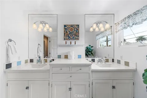 a bedroom with a bed and lamp