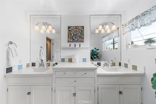 a bedroom with a bed and lamp