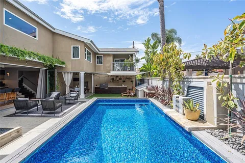 a kitchen with stainless steel appliances granite countertop a stove and a large window