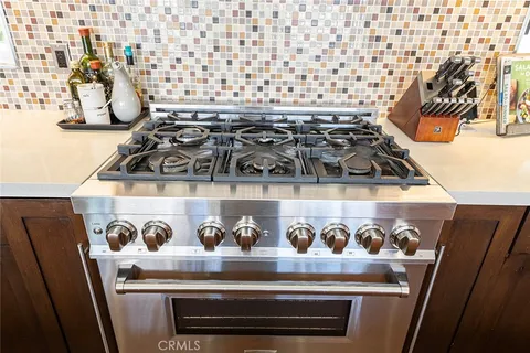 a view of a house with swimming pool and sitting area