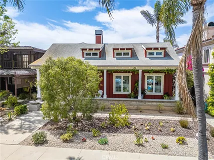 a dining room with furniture a rug and wooden floor
