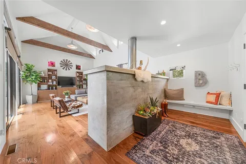a kitchen with stainless steel appliances granite countertop a sink and a refrigerator