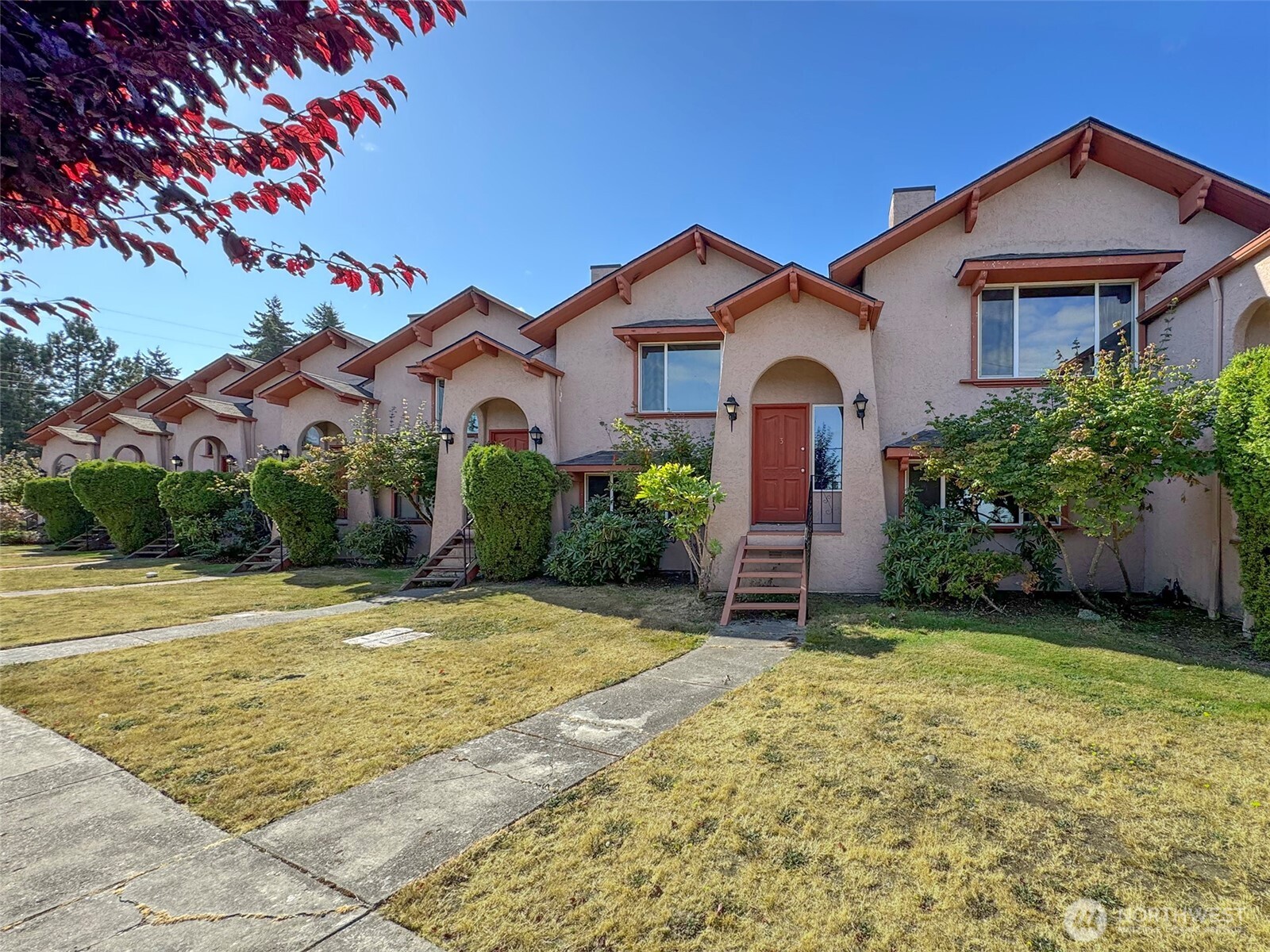 1212 Craig Avenue, Unit 3 Port Angeles, WA 98362 - Photo 1 of 38 a front view of a house with a garden
