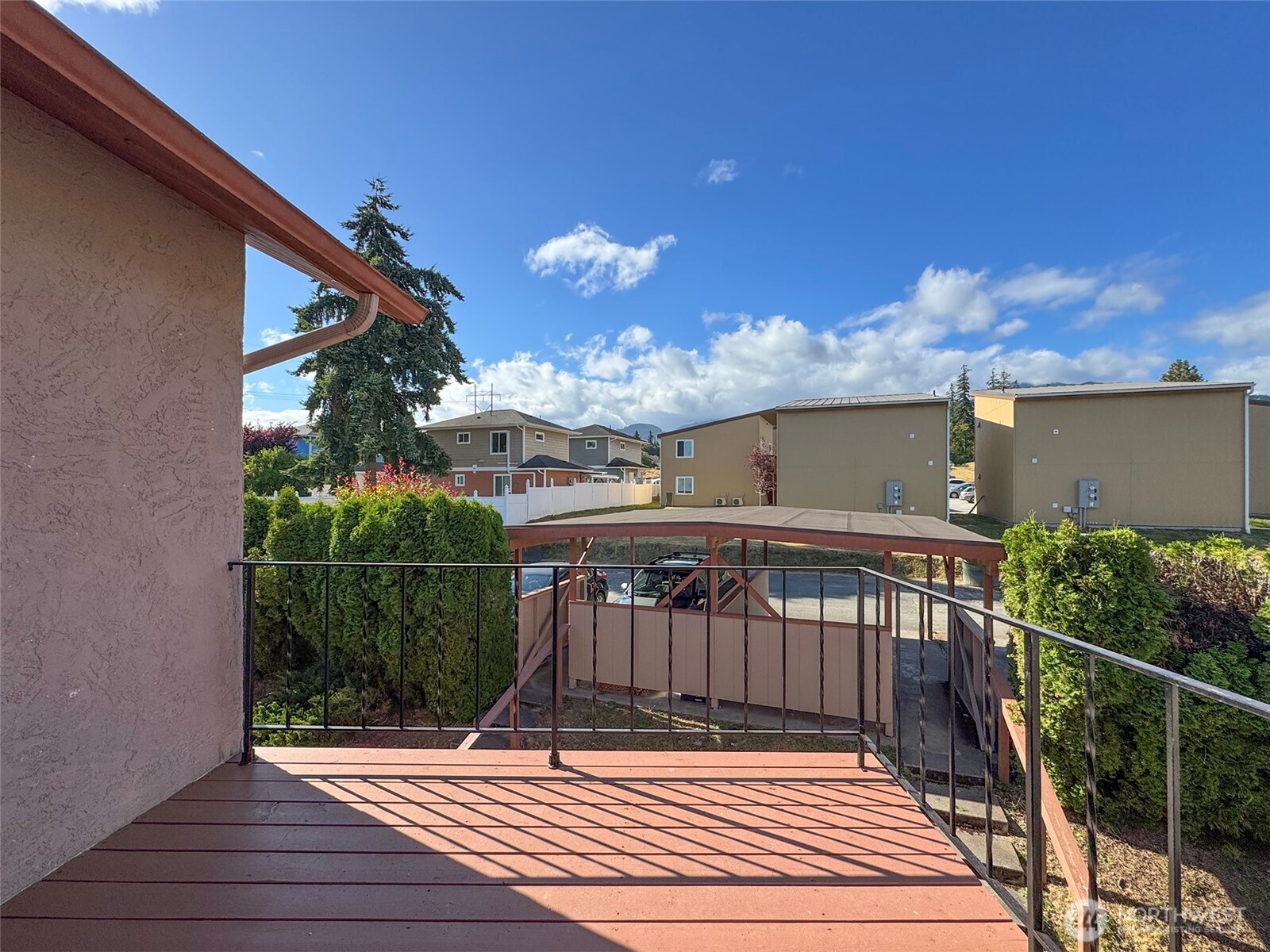 1212 Craig Avenue, Unit 3 Port Angeles, WA 98362 - Photo 16 of 38 a view of balcony with wooden floor and potted plants