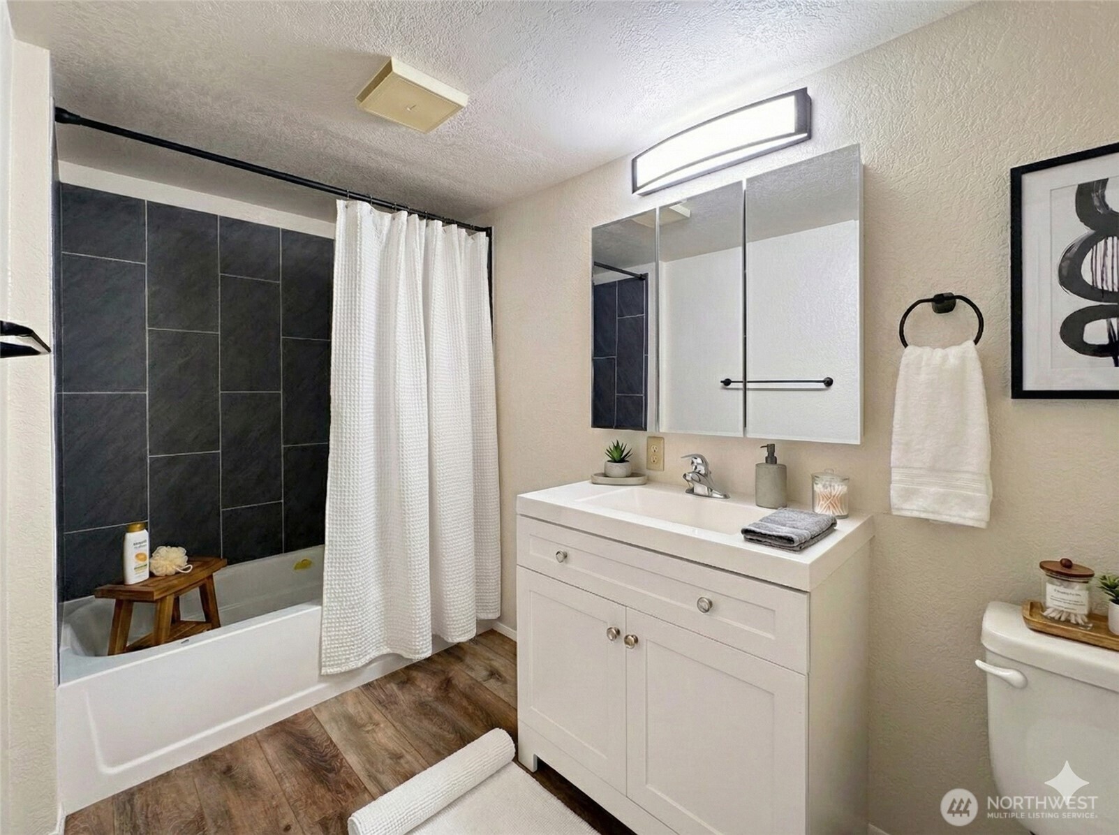 1212 Craig Avenue, Unit 3 Port Angeles, WA 98362 - Photo 25 of 38 a bathroom with a sink a toilet and shower