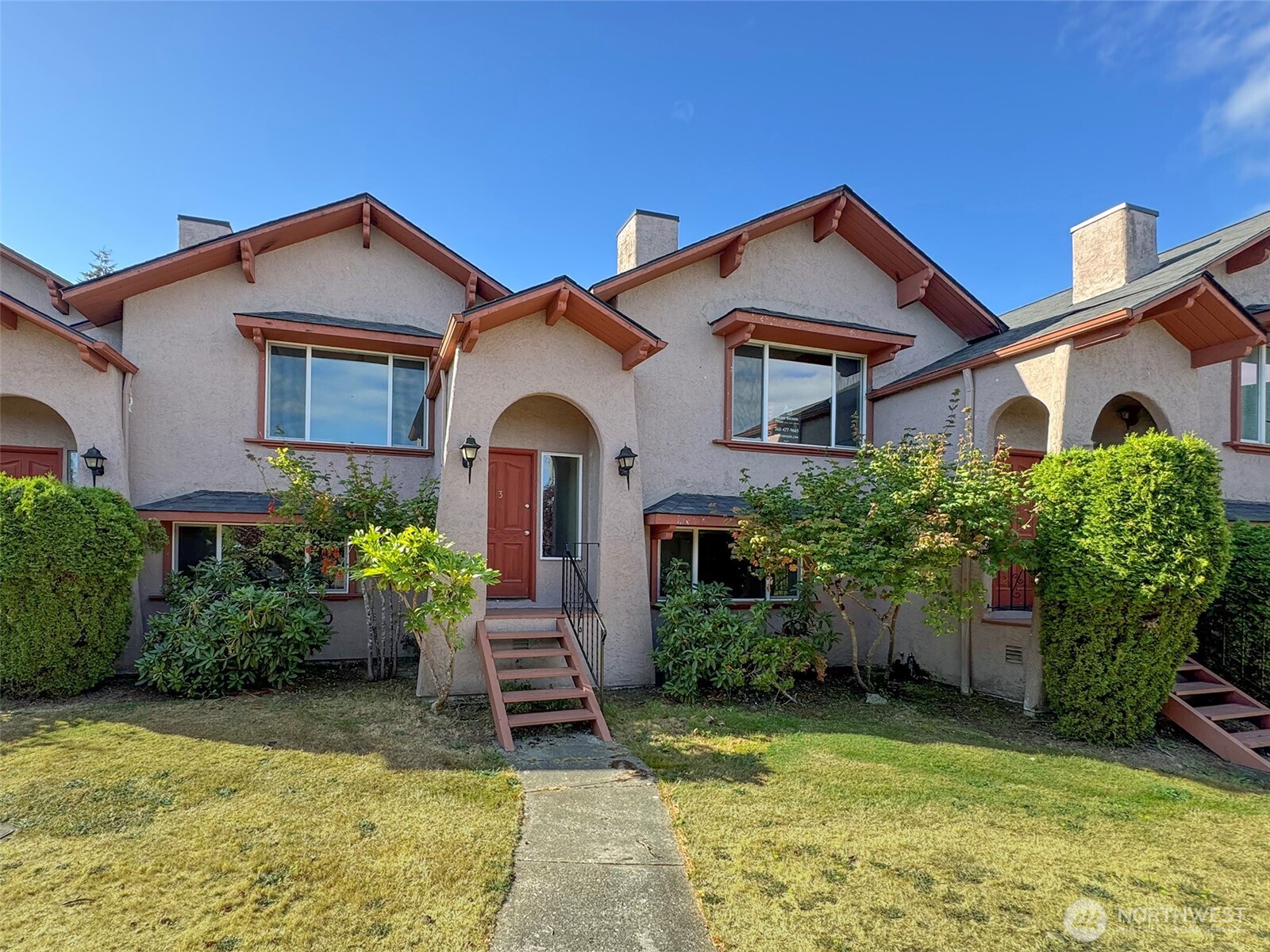 1212 Craig Avenue, Unit 3 Port Angeles, WA 98362 - Photo 3 of 38 a front view of a house with a yard