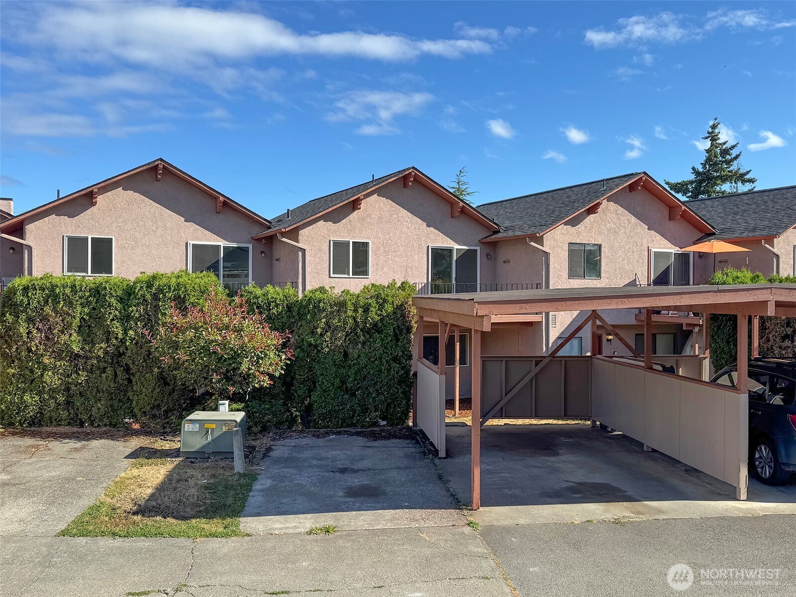 1212 Craig Avenue, Unit 3 Port Angeles, WA 98362 - Photo 36 of 38 a view of a house with a yard and large tree