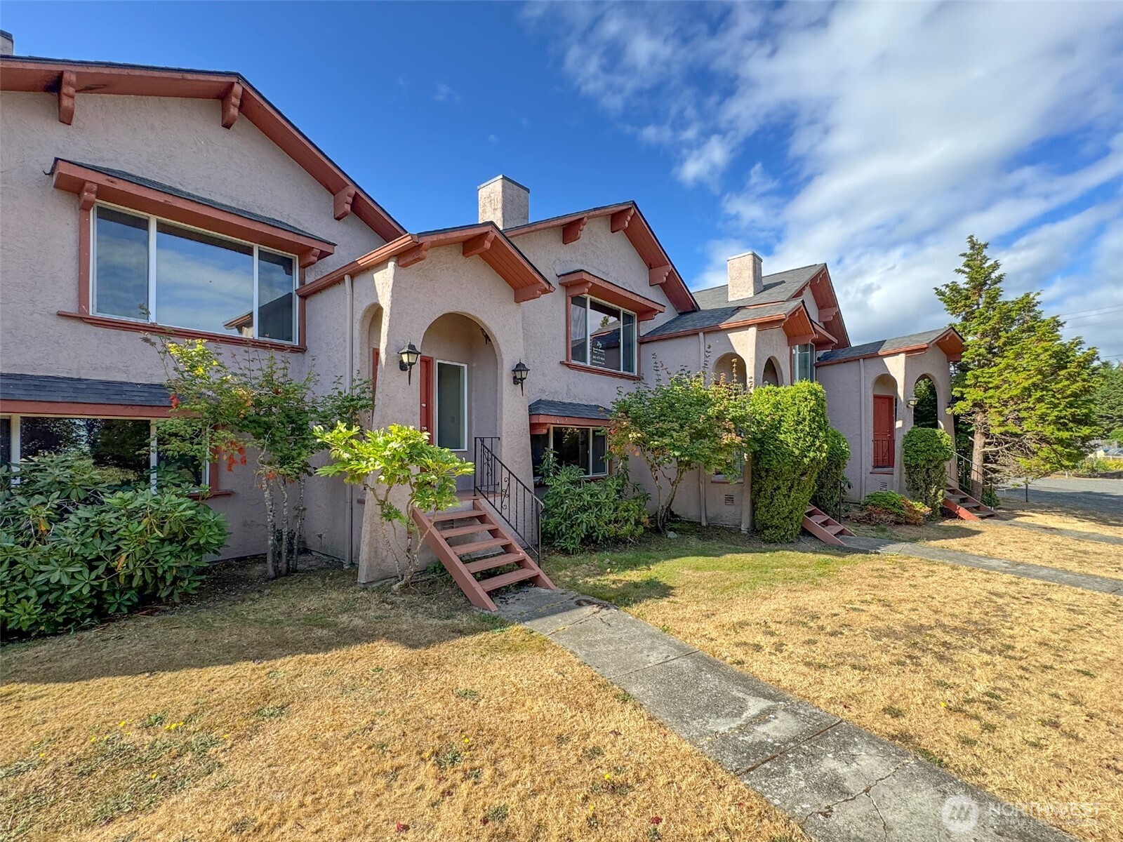 1212 Craig Avenue, Unit 3 Port Angeles, WA 98362 - Photo 38 of 38 a front view of a house with a yard