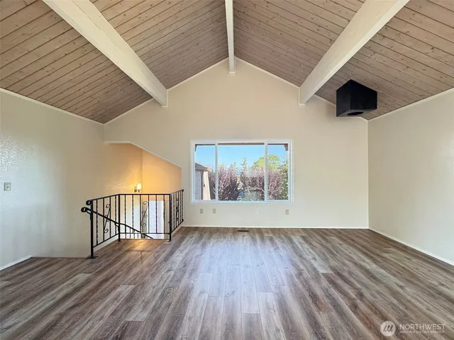 a living room with furniture or couch and a wooden floor
