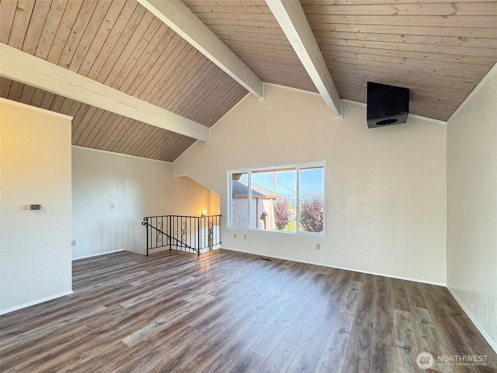 1212 Craig Avenue, Unit 3 Port Angeles, WA 98362 - Photo 8 of 38 a view of an empty room with wooden floor and a window