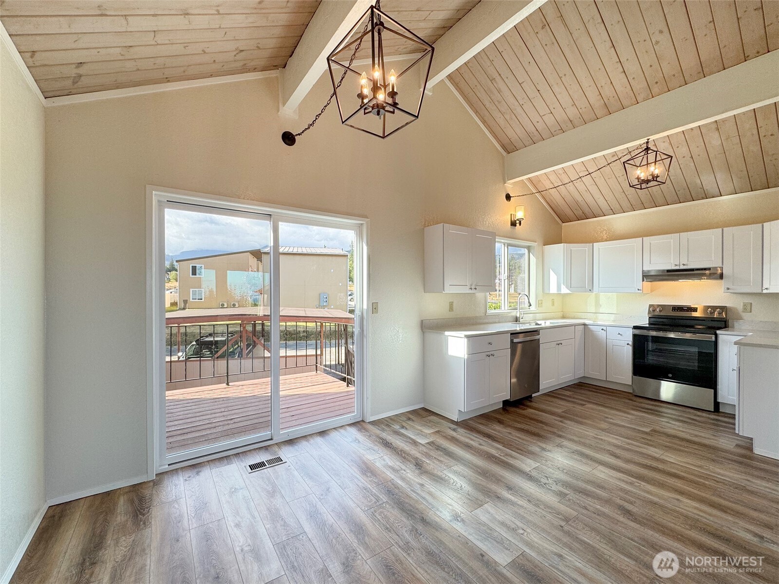 1212 Craig Avenue, Unit 3 Port Angeles, WA 98362 - Photo 10 of 38 a kitchen with stainless steel appliances wooden floor and a refrigerator