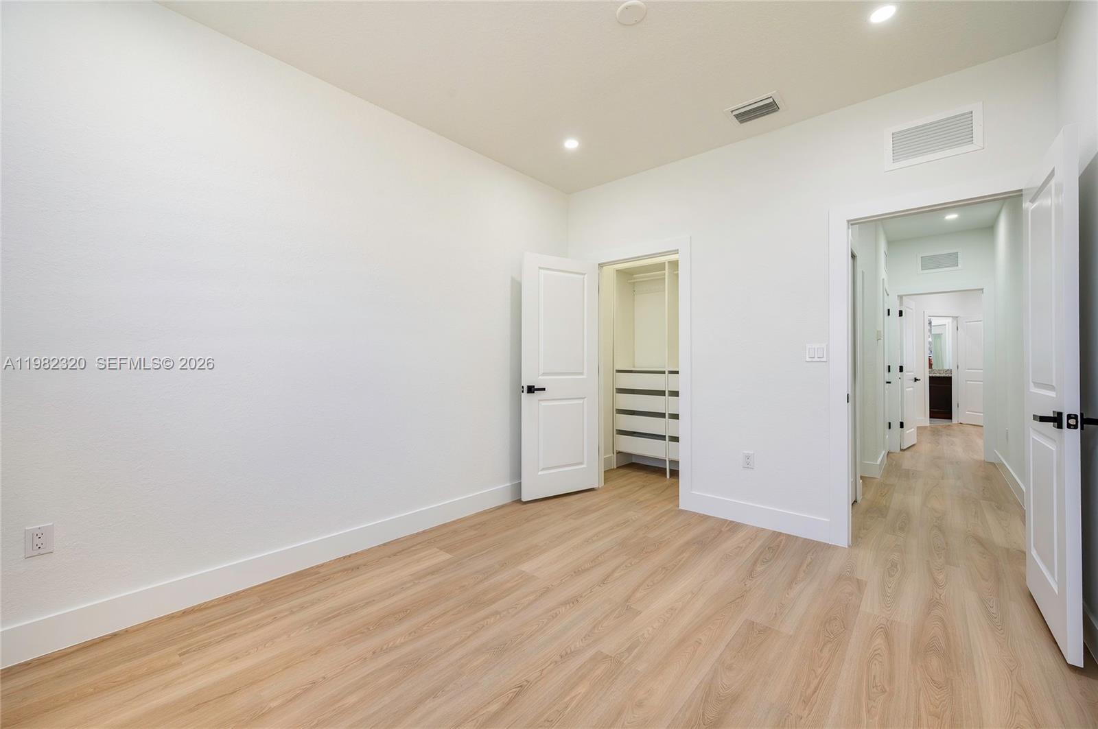 13353 Southwest 250th Terrace Homestead, FL 33032 - Photo 16 of 25 wooden floor in an empty room