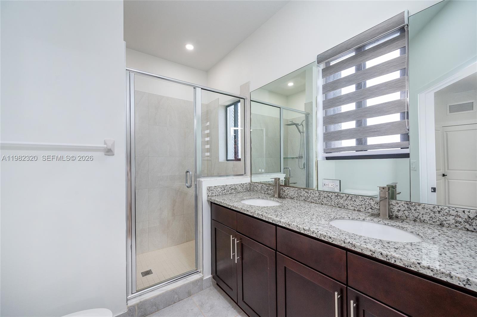 13353 Southwest 250th Terrace Homestead, FL 33032 - Photo 17 of 25 a bathroom with a granite countertop sink mirror and double