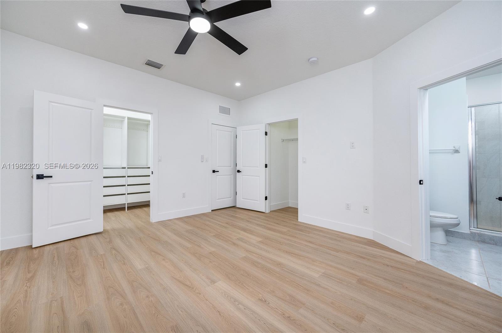 13353 Southwest 250th Terrace Homestead, FL 33032 - Photo 20 of 25 wooden floor in an empty room with a window