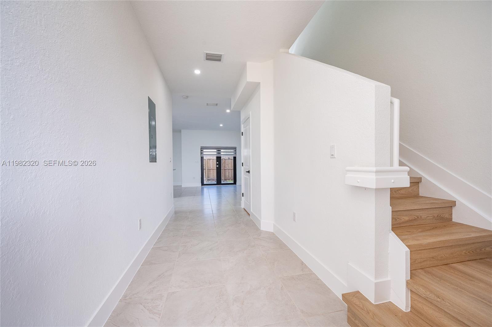 13353 Southwest 250th Terrace Homestead, FL 33032 - Photo 4 of 25 a view of a hallway with staircase