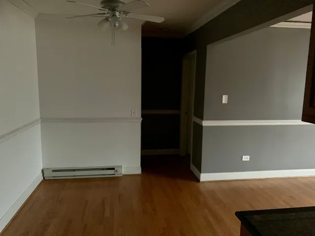 wooden floor and cabinet in an empty room