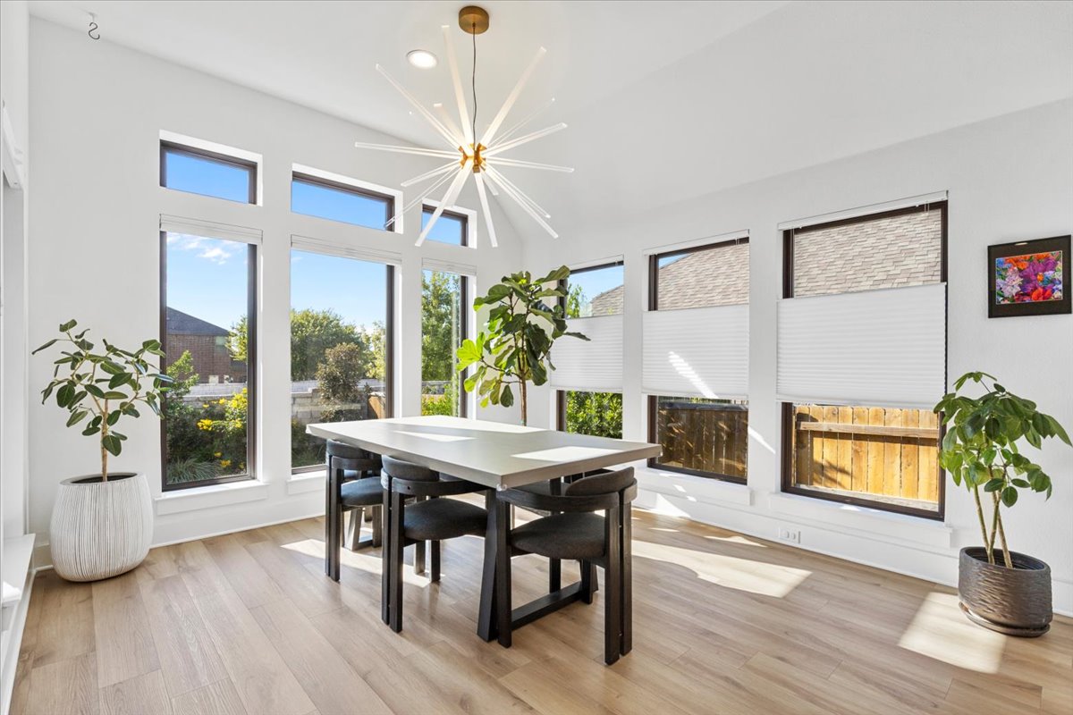 398 Trout River Road Kyle, TX 78640 - Photo 16 of 40 Dining room featuring suspended lighting and light wood finished floors