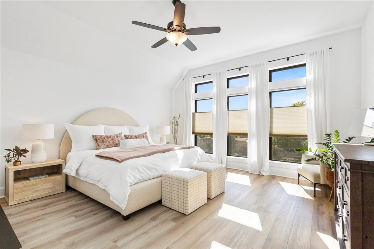 398 Trout River Road Kyle, TX 78640 - Photo 17 of 40 Bedroom with light wood finished floors, ceiling fan, and lofted ceiling