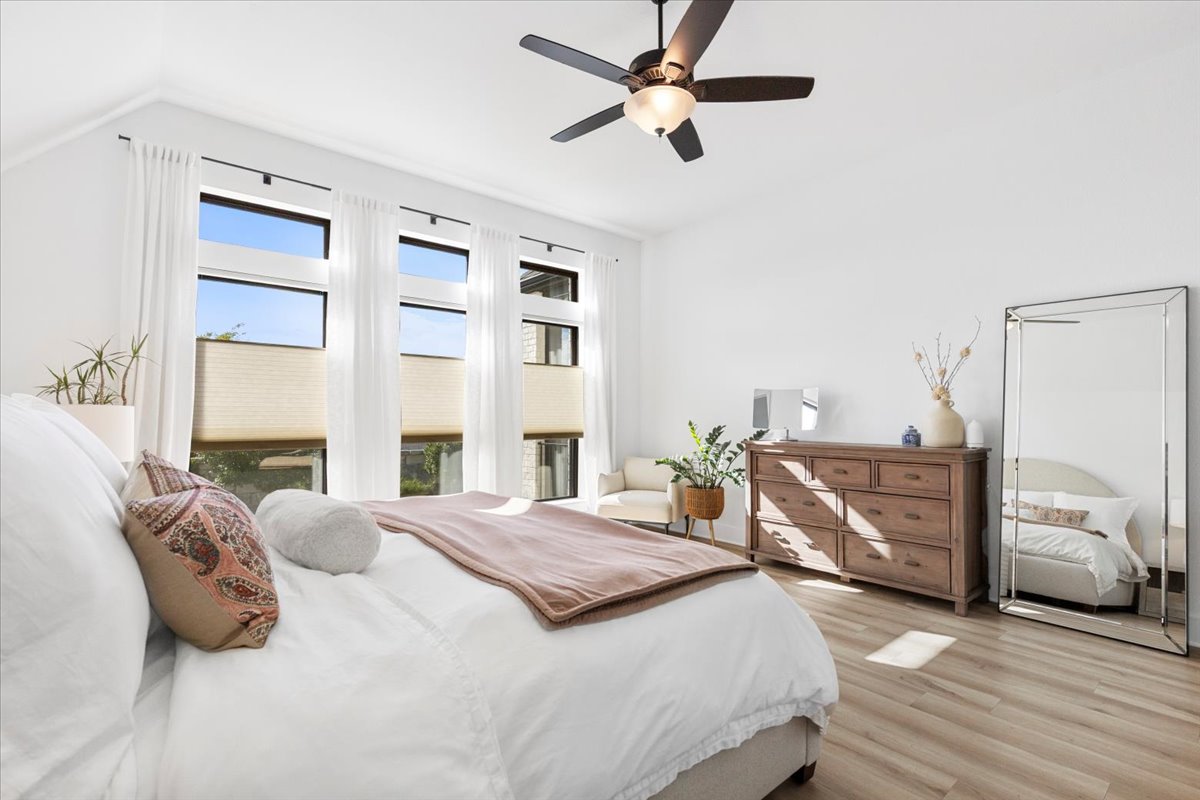 398 Trout River Road Kyle, TX 78640 - Photo 18 of 40 Bedroom featuring wood finished floors, ceiling fan, and vaulted ceiling