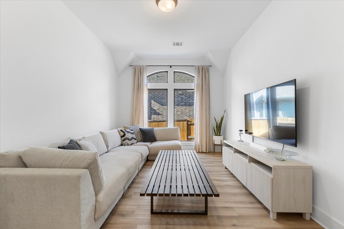 398 Trout River Road Kyle, TX 78640 - Photo 27 of 40 Living room with light wood finished floors and baseboards