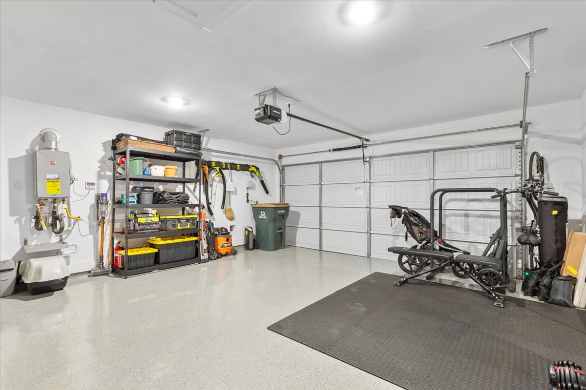 398 Trout River Road Kyle, TX 78640 - Photo 30 of 40 Garage with a garage door opener