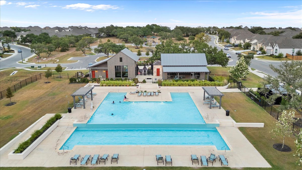 398 Trout River Road Kyle, TX 78640 - Photo 37 of 40 Community pool with a patio and a residential view