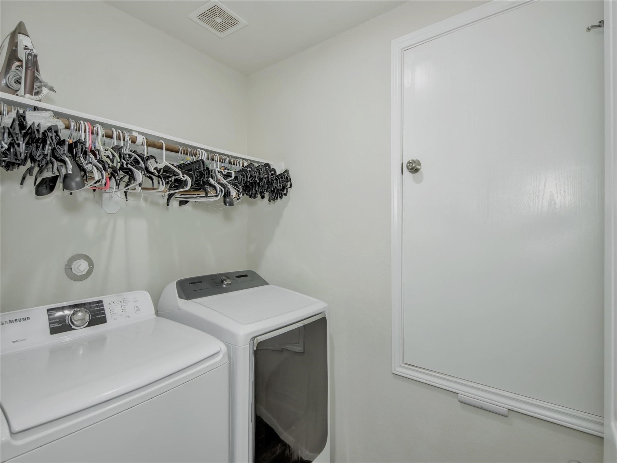 9906 Orchid Spring Lane Houston, TX 77044 - Photo 16 of 27 a utility room with dryer and washer