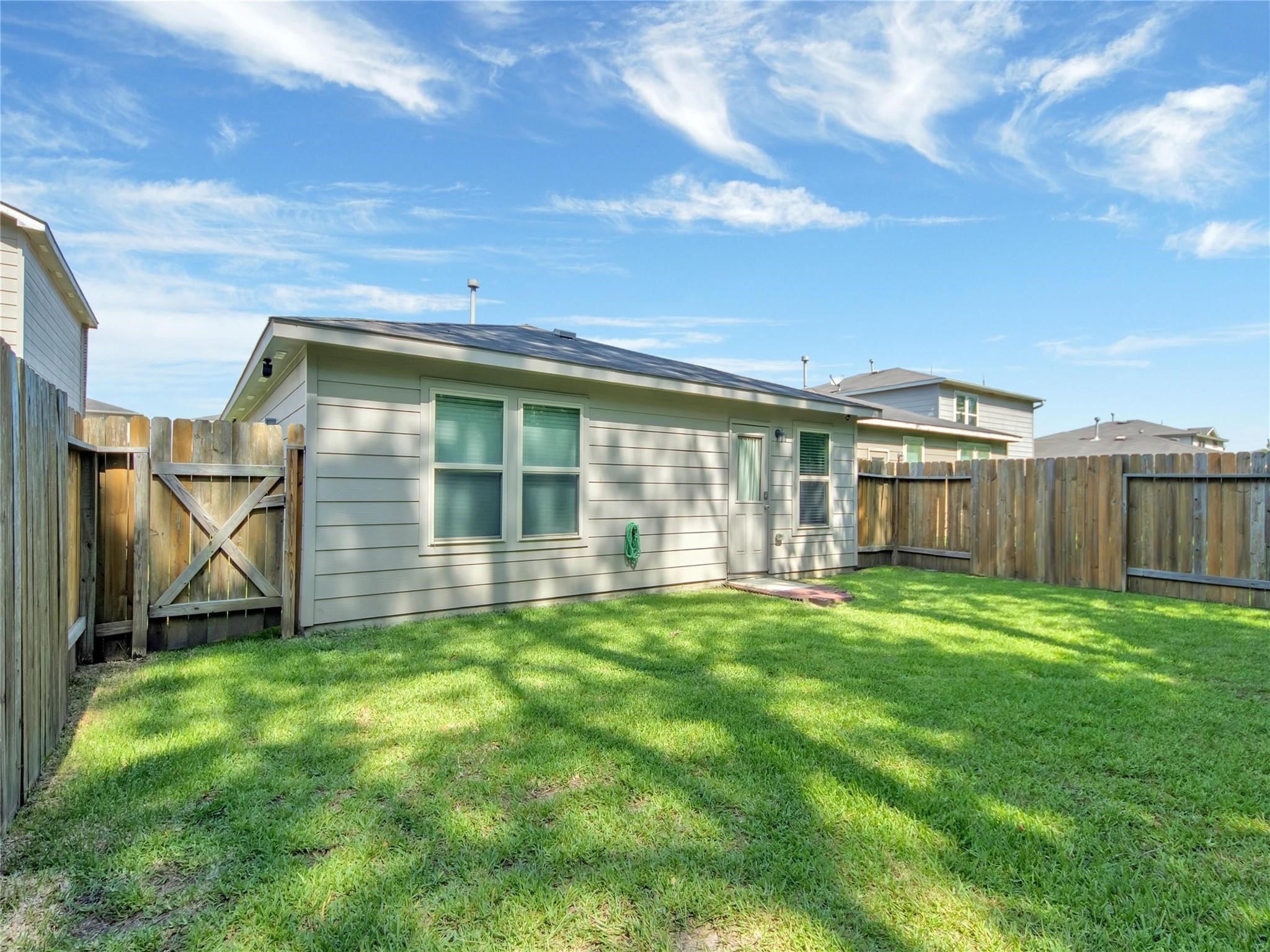 9906 Orchid Spring Lane Houston, TX 77044 - Photo 26 of 27 a view of a back yard of the house