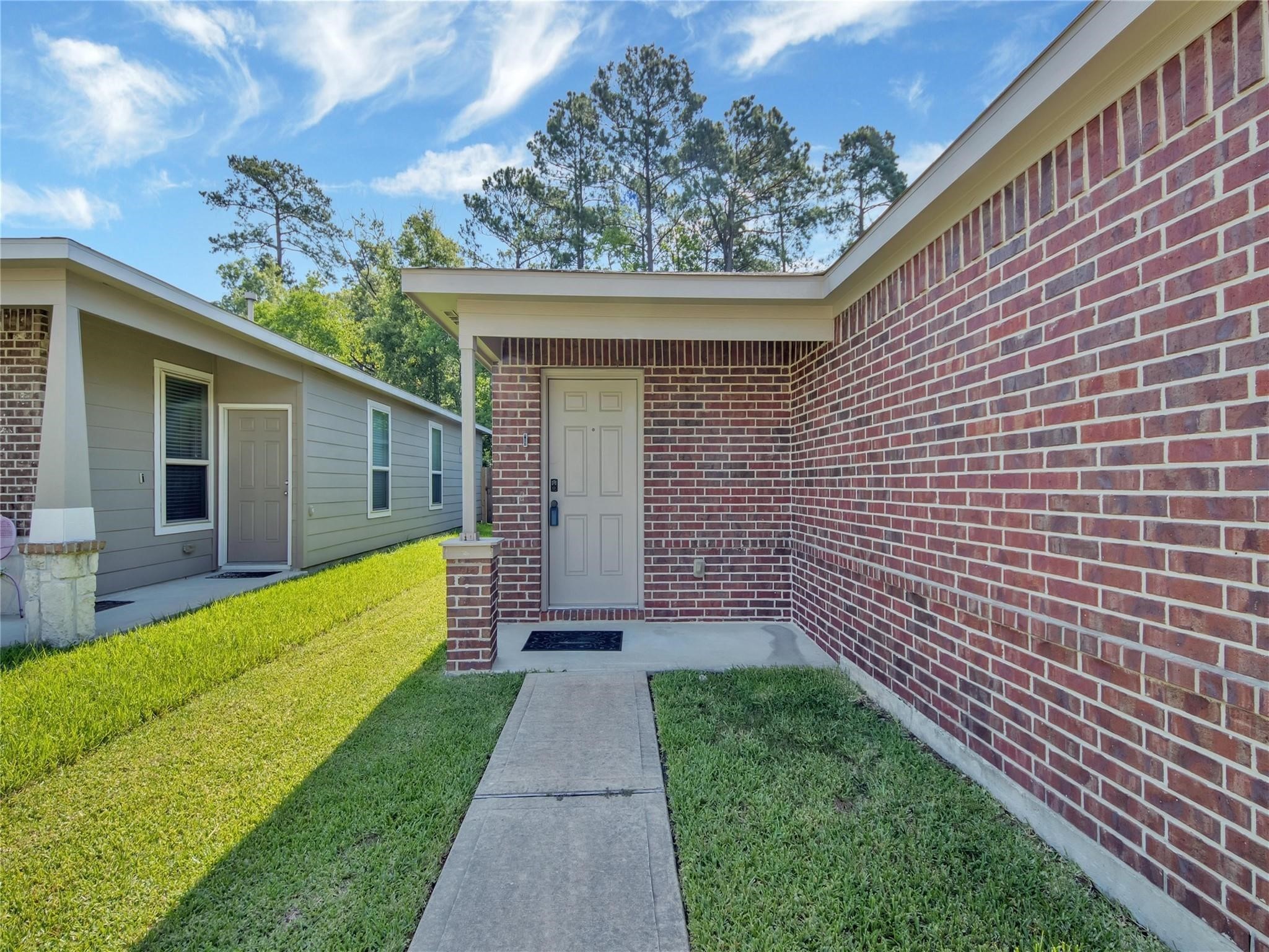 9906 Orchid Spring Lane Houston, TX 77044 - Photo 4 of 27 a view of a back yard with a wooden fence