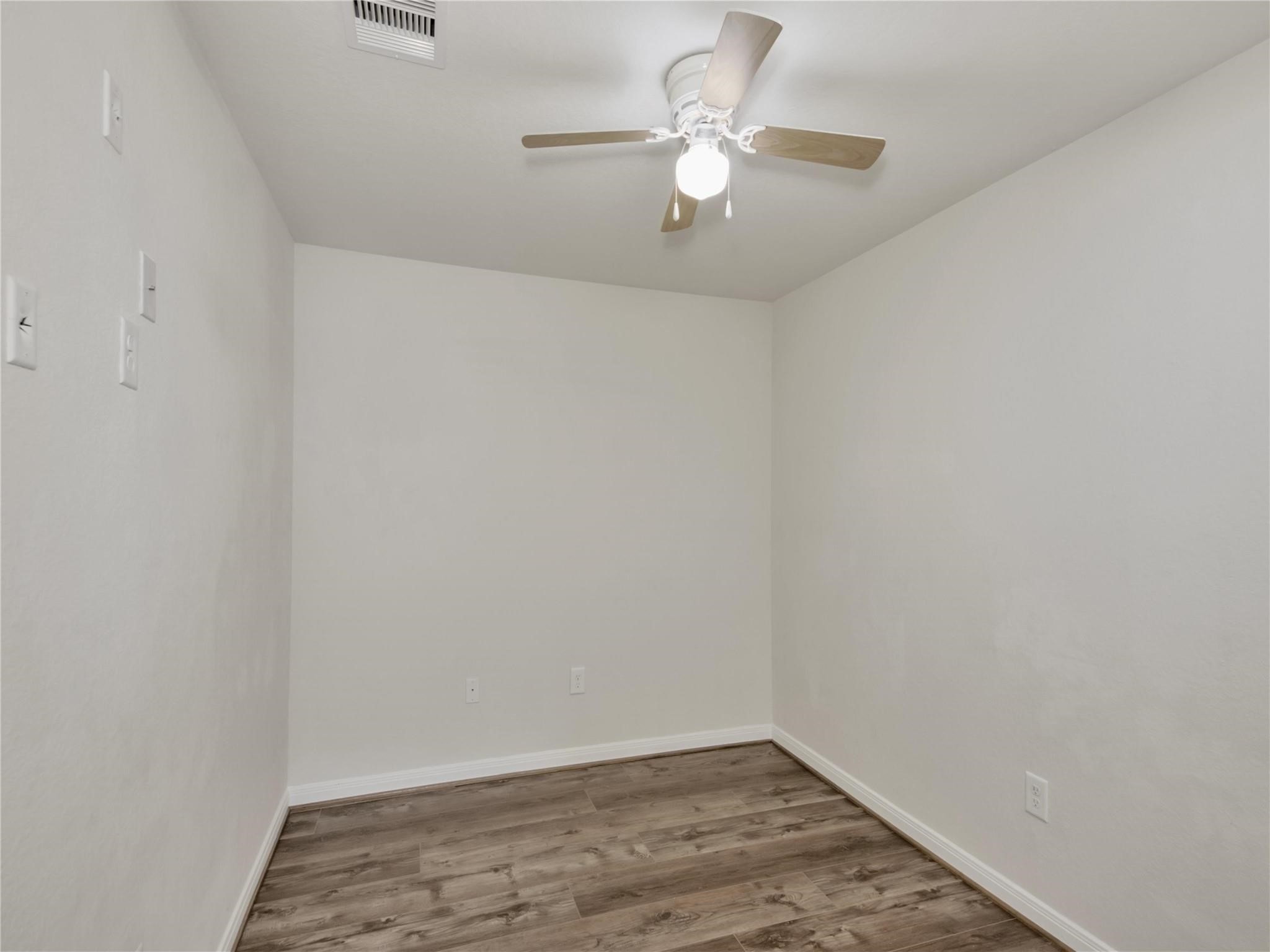 9906 Orchid Spring Lane Houston, TX 77044 - Photo 7 of 27 wooden floor in an empty room