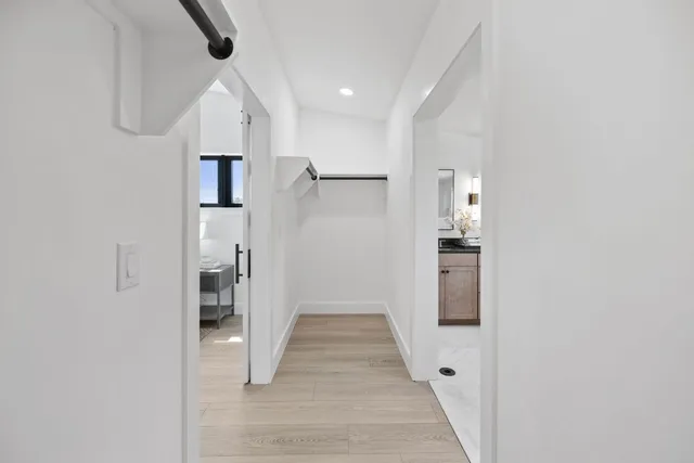 a bedroom with a bed couch and window