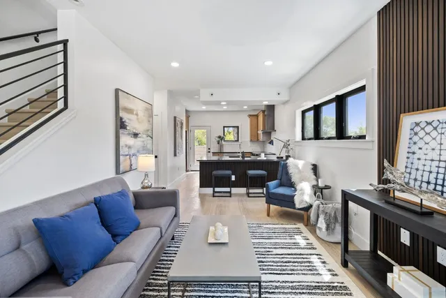 a living room with furniture and a rug
