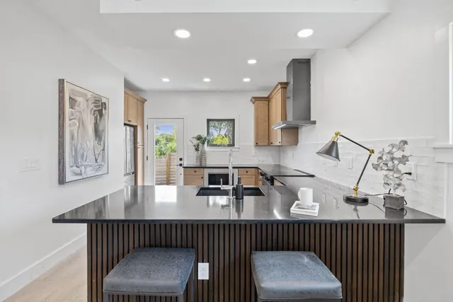 a view of kitchen and dining area with furniture