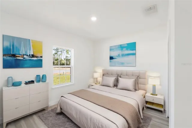 a bedroom with a bed and a window