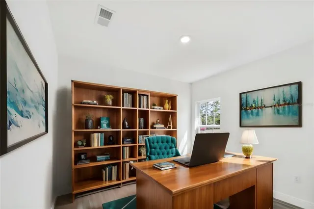 a view of a workspace with furniture