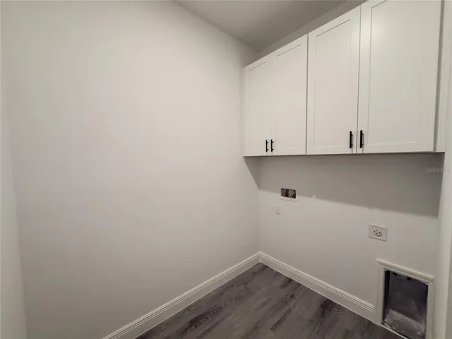 a view of cabinets and wooden floor