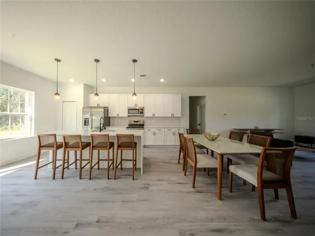 a view of a dining room with furniture