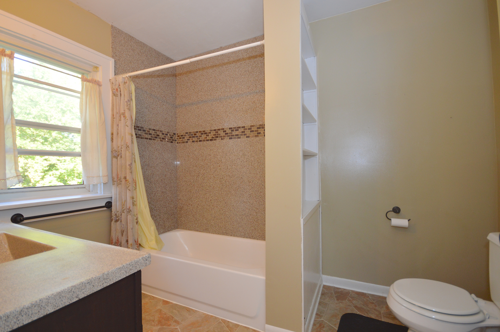 1038 Ferndale Street Gurnee, IL 60031 - Photo 15 of 17 a bathroom with a sink and a bathtub