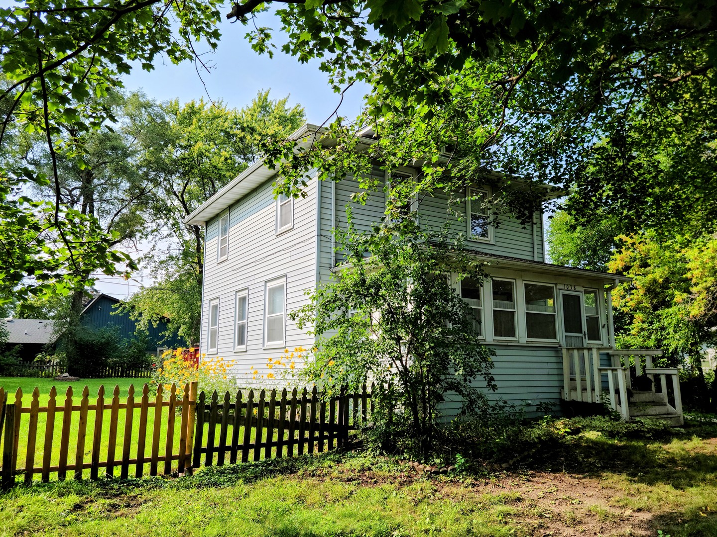 1038 Ferndale Street Gurnee, IL 60031 - Photo 2 of 17 a front view of a house with a garden