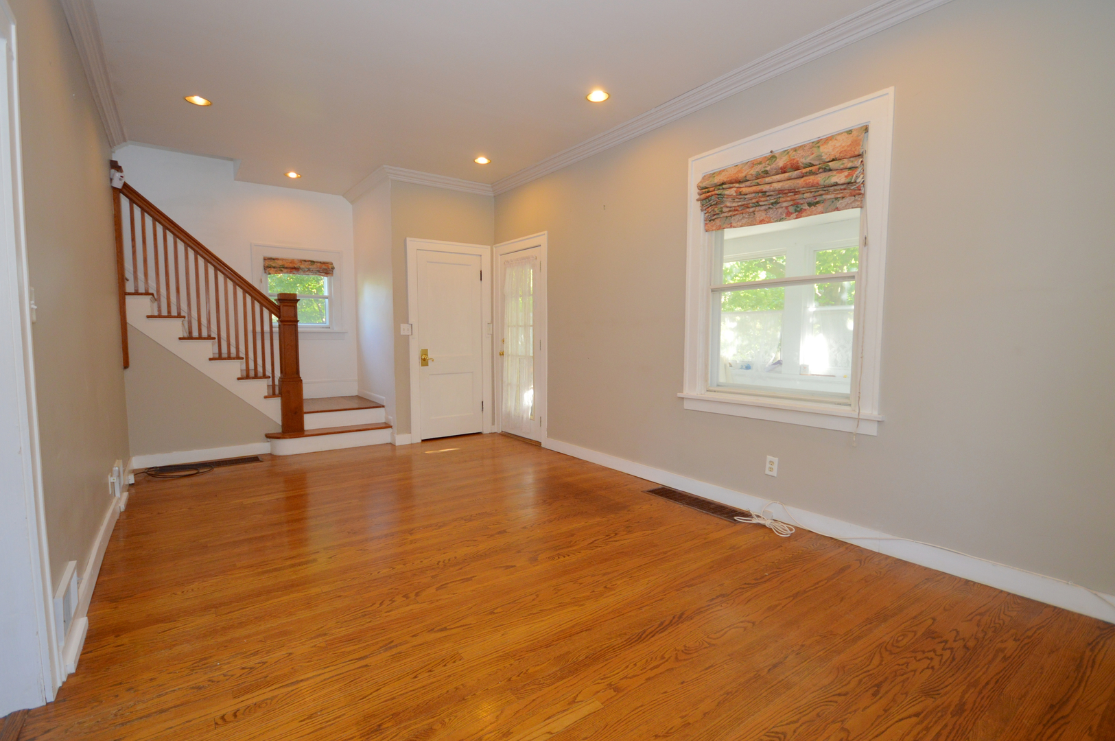 1038 Ferndale Street Gurnee, IL 60031 - Photo 5 of 17 a view of an empty room with wooden floor and a window