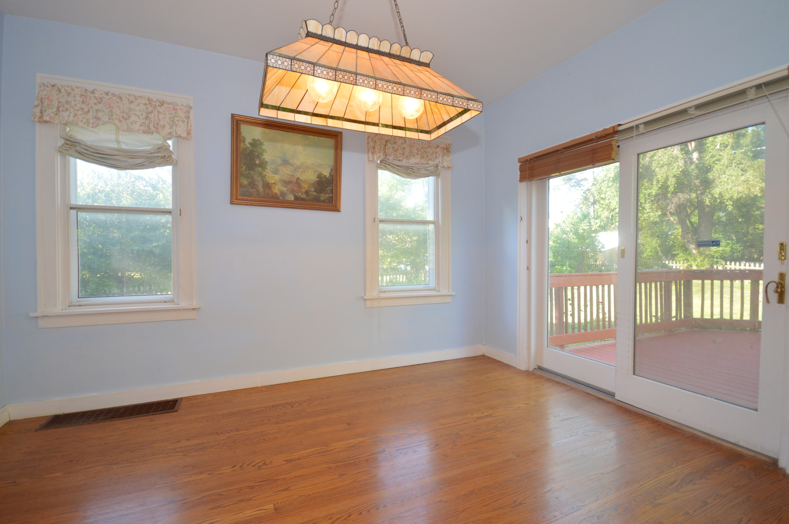 1038 Ferndale Street Gurnee, IL 60031 - Photo 6 of 17 a view of an empty room with wooden floor and a window