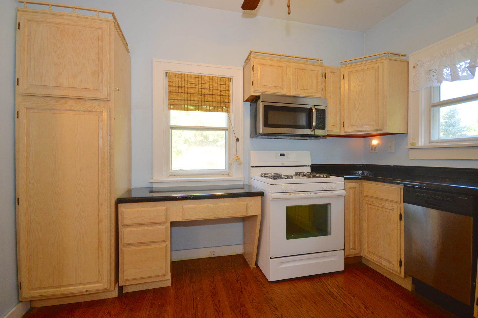 1038 Ferndale Street Gurnee, IL 60031 - Photo 9 of 17 a kitchen with a stove microwave and sink