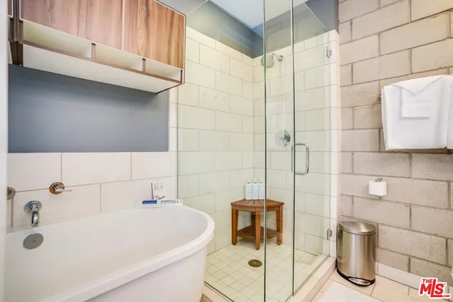 a bathroom with a toilet a sink and a shower