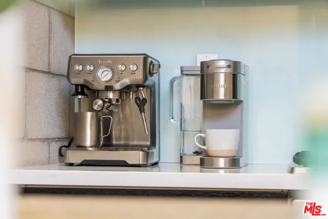 a bedroom with a bed and glass windows