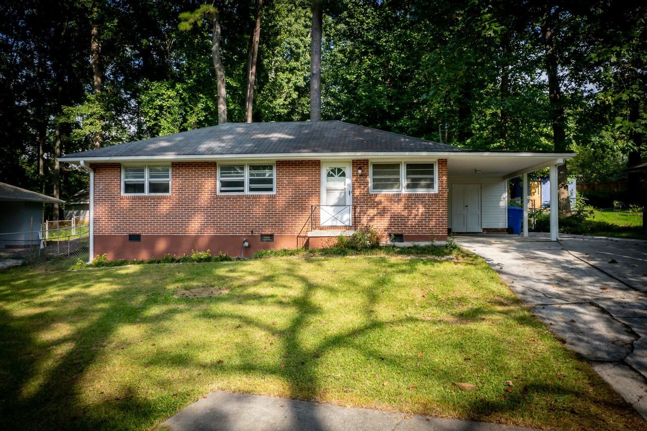 4650 Bartlett Road Forest Park, GA 30297 - Photo 1 of 1 a view of a house with yard and plants