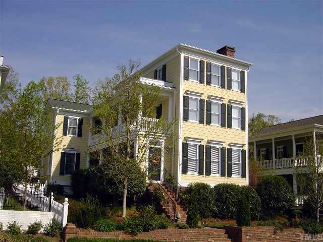 8528 Society Place Raleigh, NC 27615 - Photo 1 of 1 a front view of a house with a yard