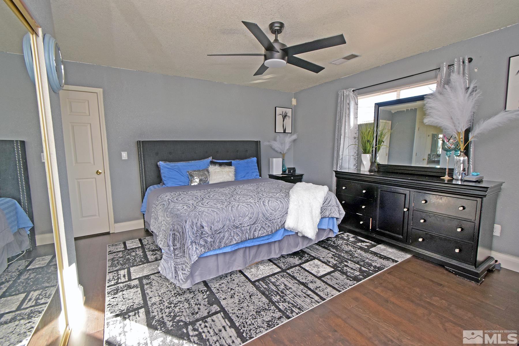 902 Vine Street Reno, NV 89503 - Photo 15 of 20 a bedroom with a bed and a mirror on the dresser