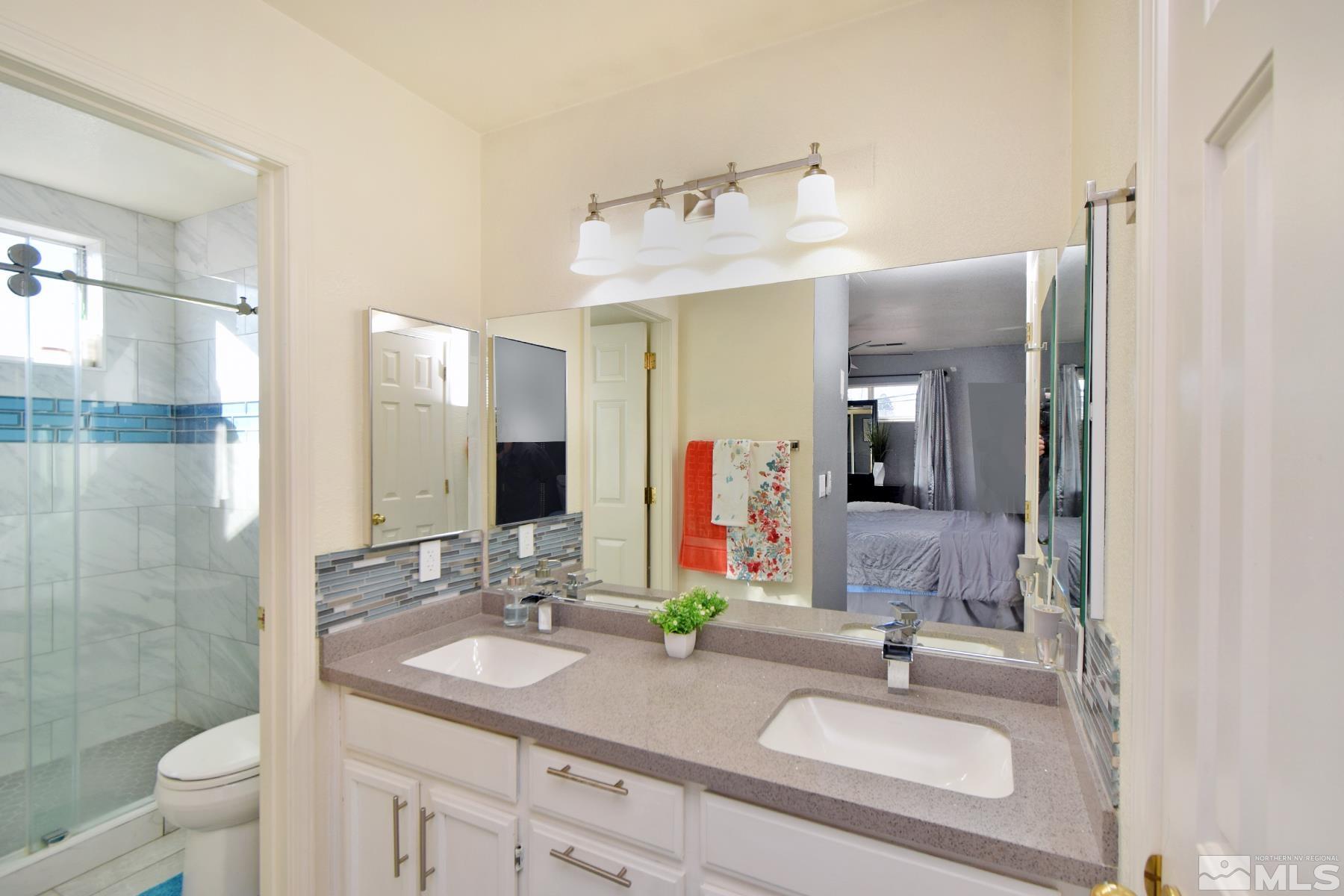 902 Vine Street Reno, NV 89503 - Photo 17 of 20 a bathroom with a sink and a mirror