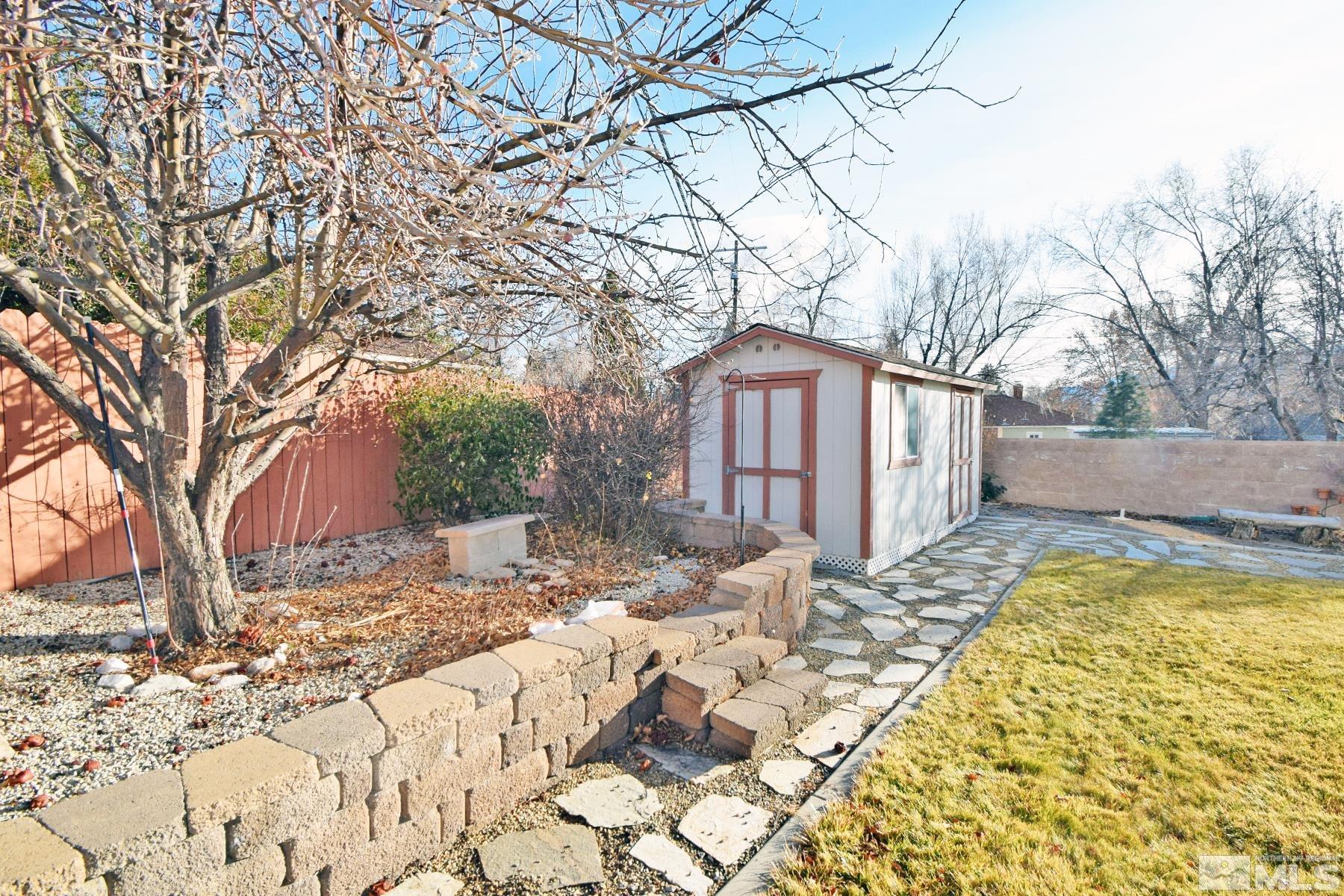 902 Vine Street Reno, NV 89503 - Photo 4 of 20 a view of white house with a yard covered in snow